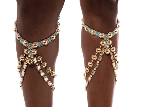 Cropped image of african dancer legs.