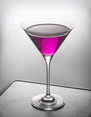 glass of violet cocktail