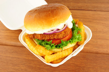 Chicken Sandwich And Fries In Take Away Box