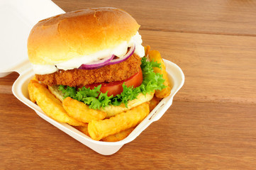 Chicken Sandwich And Fries In Take Away Box