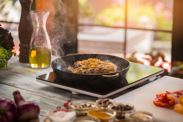 Meat on pan. Pieces of fried onion. How to roast pork. Best dish for dinner.