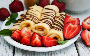 crepes with strawberries and chocolate sauce