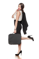 Fototapeta premium young business woman in a skirt with a bag with a jacket in her hand