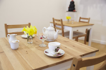 Fototapeta na wymiar Interior Of Empty Tea Shop With Tables And Crockery