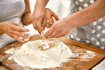 Obraz na płótnie Canvas Young Couple Baking Yeast Cake
