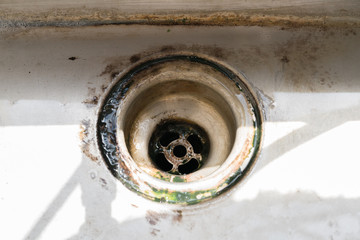 old dirty sink with rusty metal drain
