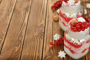 Dessert with red currant and whipped cream