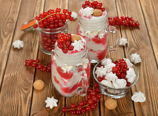 Dessert with red currant and whipped cream
