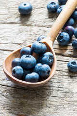 Blueberry in wooden spoon