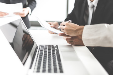 Group of business people busy discussing financial matter during