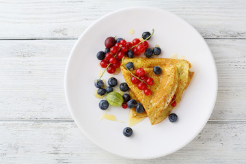 Hot pancake with fresh berry on plate