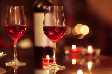 Wine glasses in a romantic setting. 