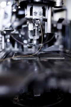 Close-up of sewing machine with needle and thread