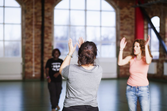 Women practicing during dance class