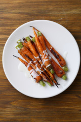Organic roasted carrots with sauce