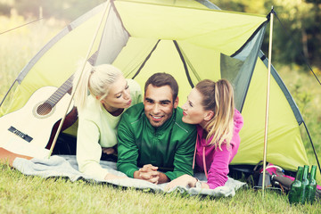 Group of friends camping in forest