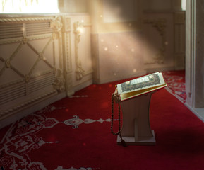 Священная для мусульман  книга  - Коран , на подставке.