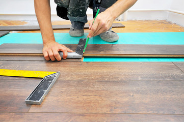 Carpenter doing laminate floor work