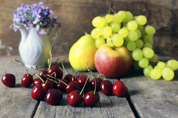fresh raw fruit on wooden background