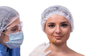 Young woman preparing for injection of botox isolated on white