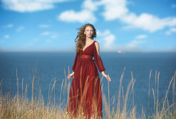 Fototapeta premium Outdoors portrait of a pensive woman in medieval dress