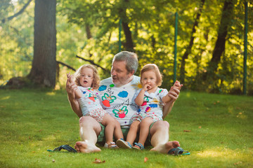 Portrait Of Grandfather With Granddaughters