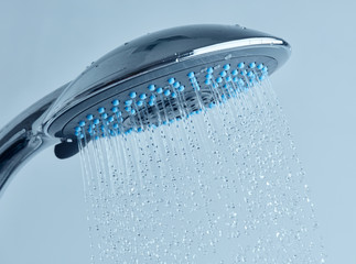 Fototapeta na wymiar Shower head with running water