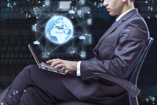 Businessman working with laptop in cloud computing concept
