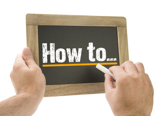 Hand writing How to... on chalkboard