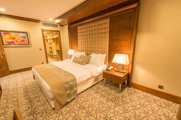 Modern hotel room with big bed