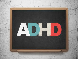 Medicine concept: ADHD on School board background
