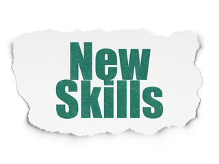 Education concept: New Skills on Torn Paper background