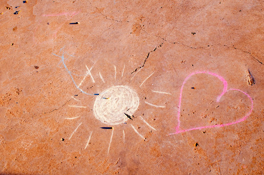 sun and heart painted on the floor