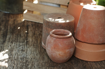 terra cotta flower pots on a wooden table
