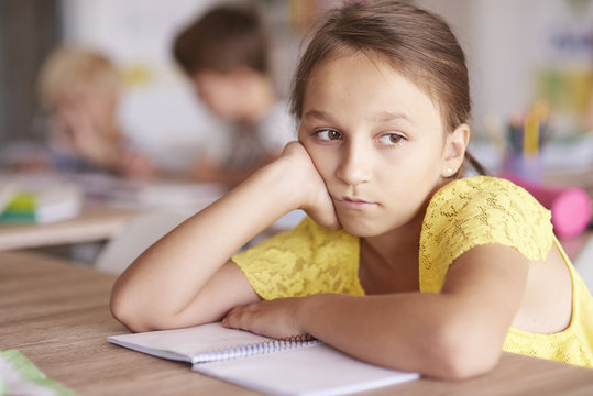 Girl bored at the lesson