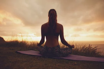 Poster Fitness woman in lotus yoga pose during sunset © Jacob Lund