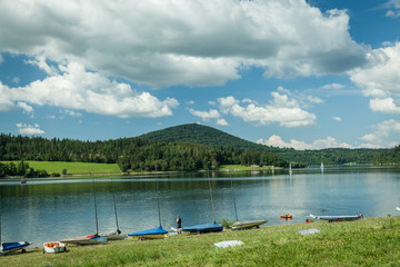 Fototapeta na wymiar Summer Holidays, sunbathing, swimming, boat on the shore of Lake