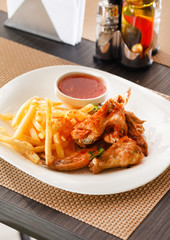 Fried chicken and fries with ketchup