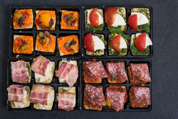 antipasti spanish tapas on dark slate