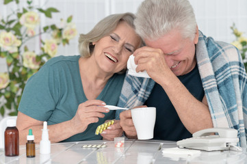 portrait of  senior couple with pills