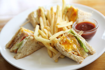 Club sandwich with on wood background