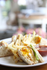 Club sandwich with on wood background