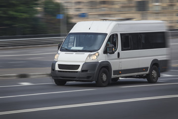minibus goes on the city street