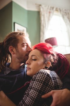 Romantic hipster couple embracing 