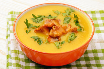 Vegetarian cuisine - cream soup with potatoes and chanterelles mushroom.