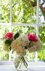 beautiful bouquet of flowers on window sill