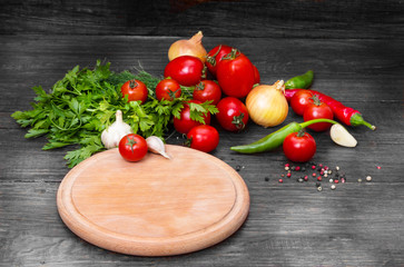 empty wooden tray on a wooden table with a background of vegetables
