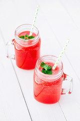 Healthy watermelon smoothie on a wood background. Freshly blended watermelon Smoothies.
