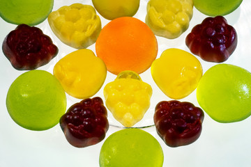Fruit gummi candies assortment on white
