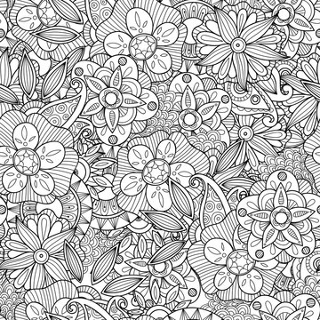 Doodle flowers seamless pattern.
Zentangle style flowers and leaves background. Black and white hand drawn herbal pattern.